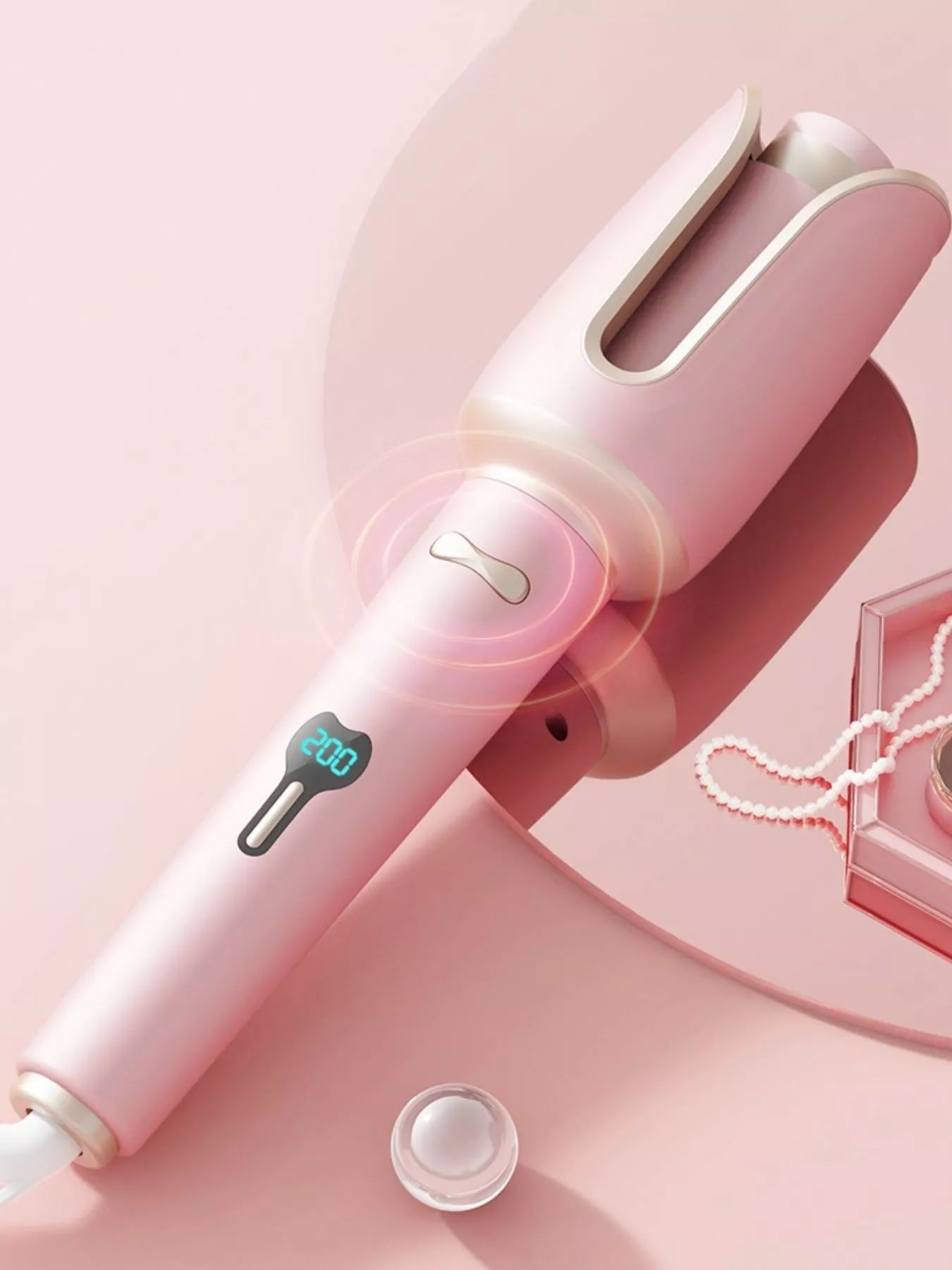 Blush pink automatic rotating ceramic hair curling iron by Trendsi with European plug for smooth, effortless curls