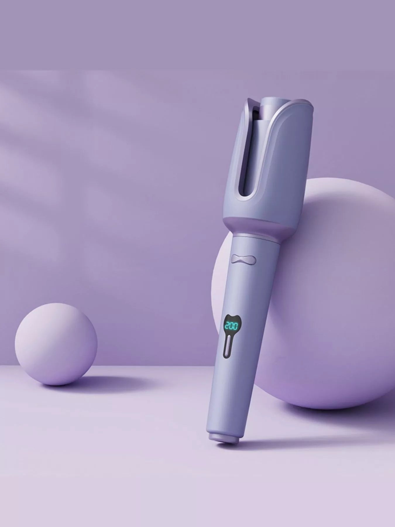Blush pink automatic rotating ceramic hair curling iron with European plug, designed for easy, even curls by Trendsi.