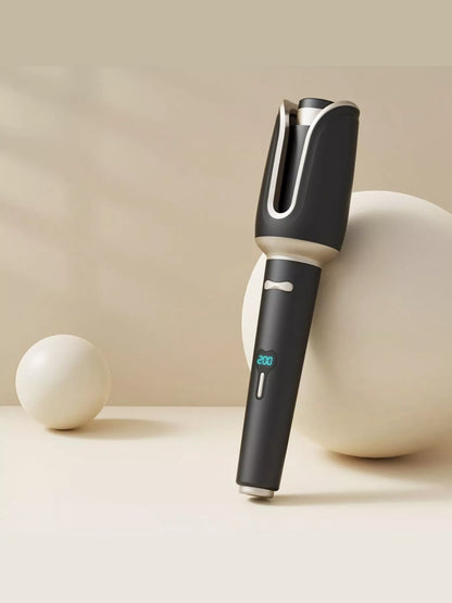Blush pink automatic rotating ceramic hair curling iron with European plug by Trendsi, designed for creating perfect curls.