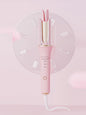 Blush pink automatic ceramic hair curling iron with European plug, featuring rotating barrel for easy styling by Trendsi.