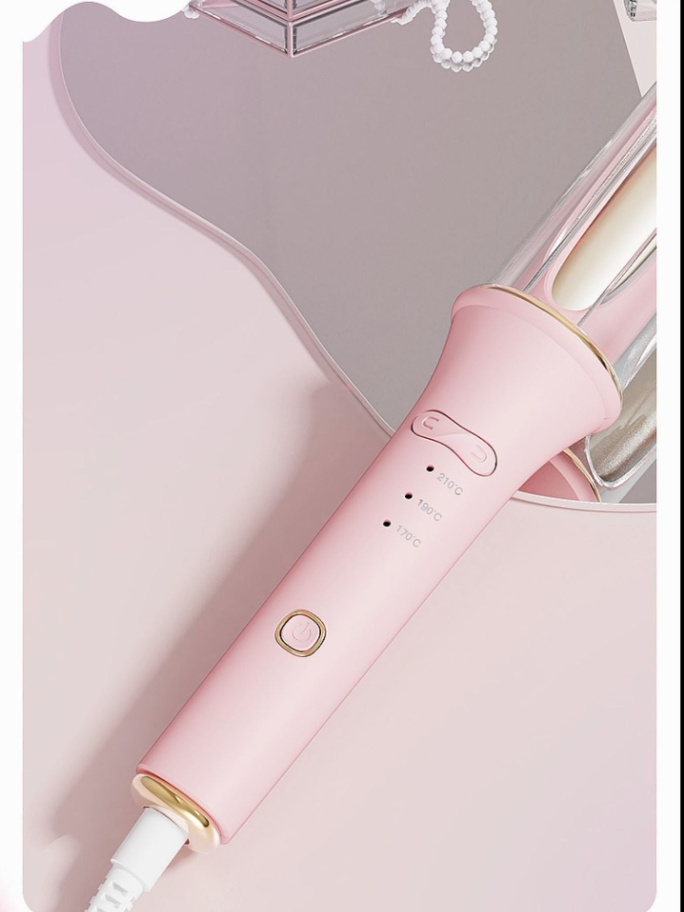 Blush pink automatic rotating ceramic hair curling iron by Trendsi with European plug for easy styling.