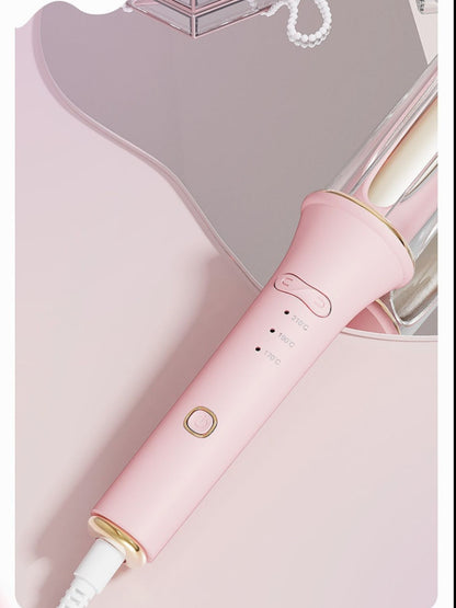 Blush pink automatic rotating ceramic hair curling iron by Trendsi with European plug for easy styling.