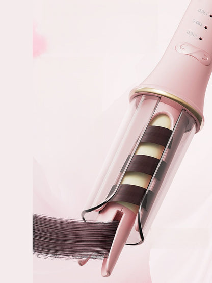 Blush pink automatic ceramic hair curling iron with European plug from Trendsi, featuring rotating barrel for easy styling.
