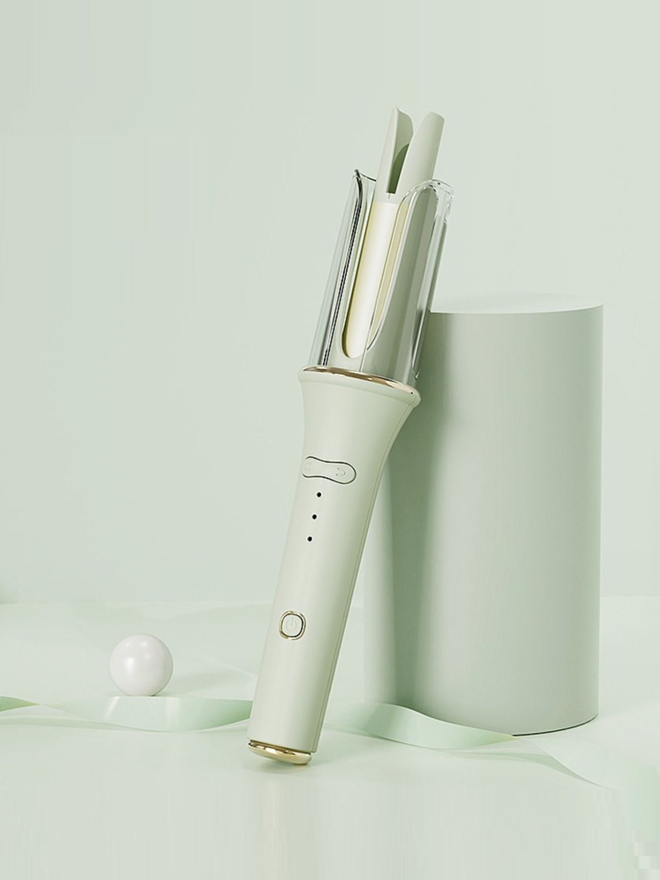 Blush pink automatic rotating ceramic hair curling iron by Trendsi with European plug for creating bouncy curls.