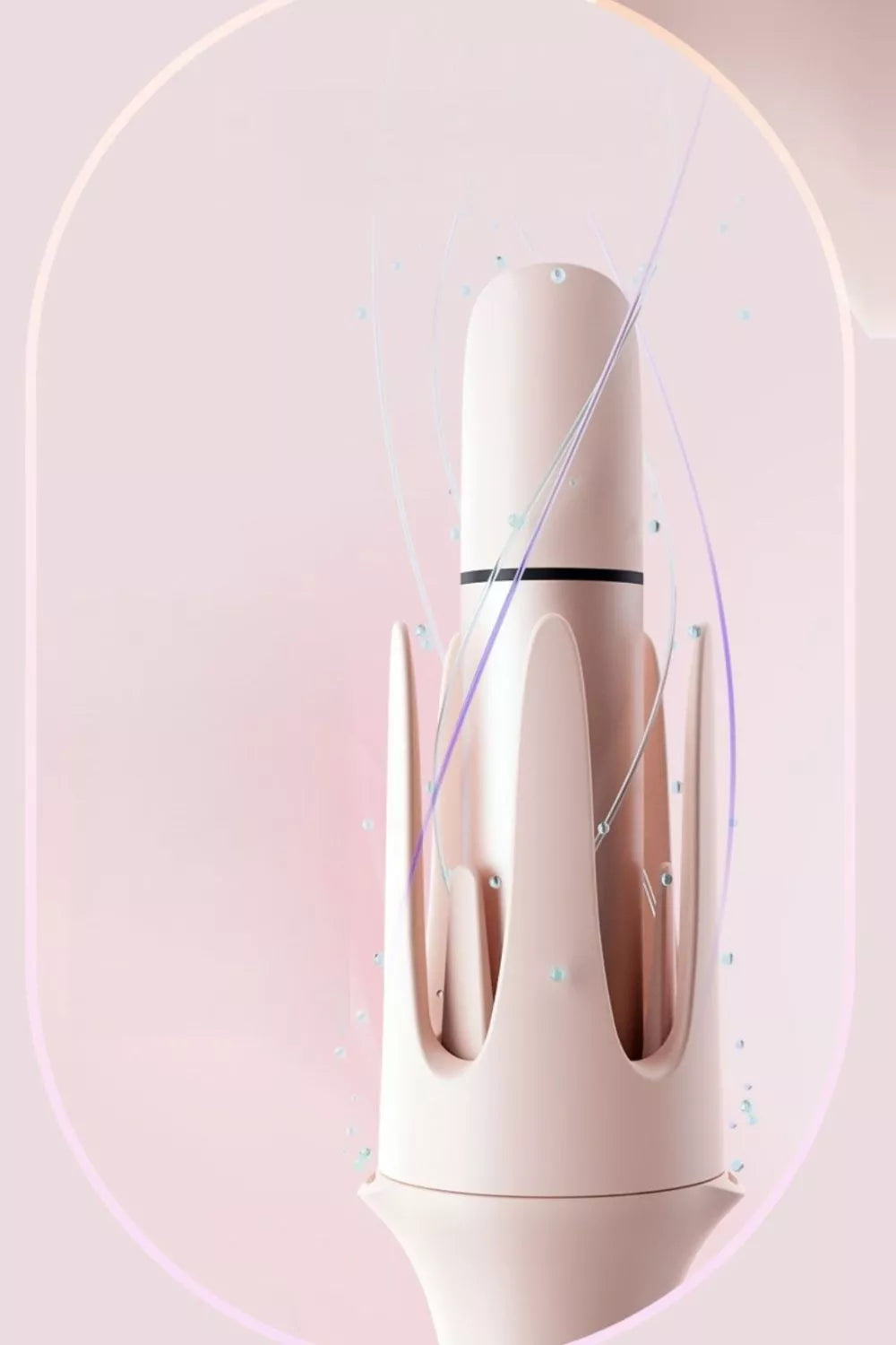 Blush pink automatic rotating curling iron by Trendsi with European plug and sleek design for easy hair curling.