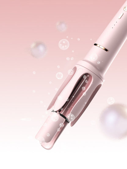 Blush pink automatic rotating hair curling iron with European plug from Trendsi, designed for easy, salon-quality curls.