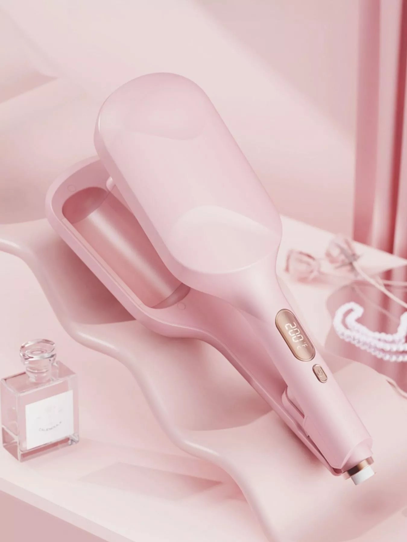 Blush pink Trendsi fast heating curling iron with European plug and ergonomic handle, ready for styling curly or straight hair.