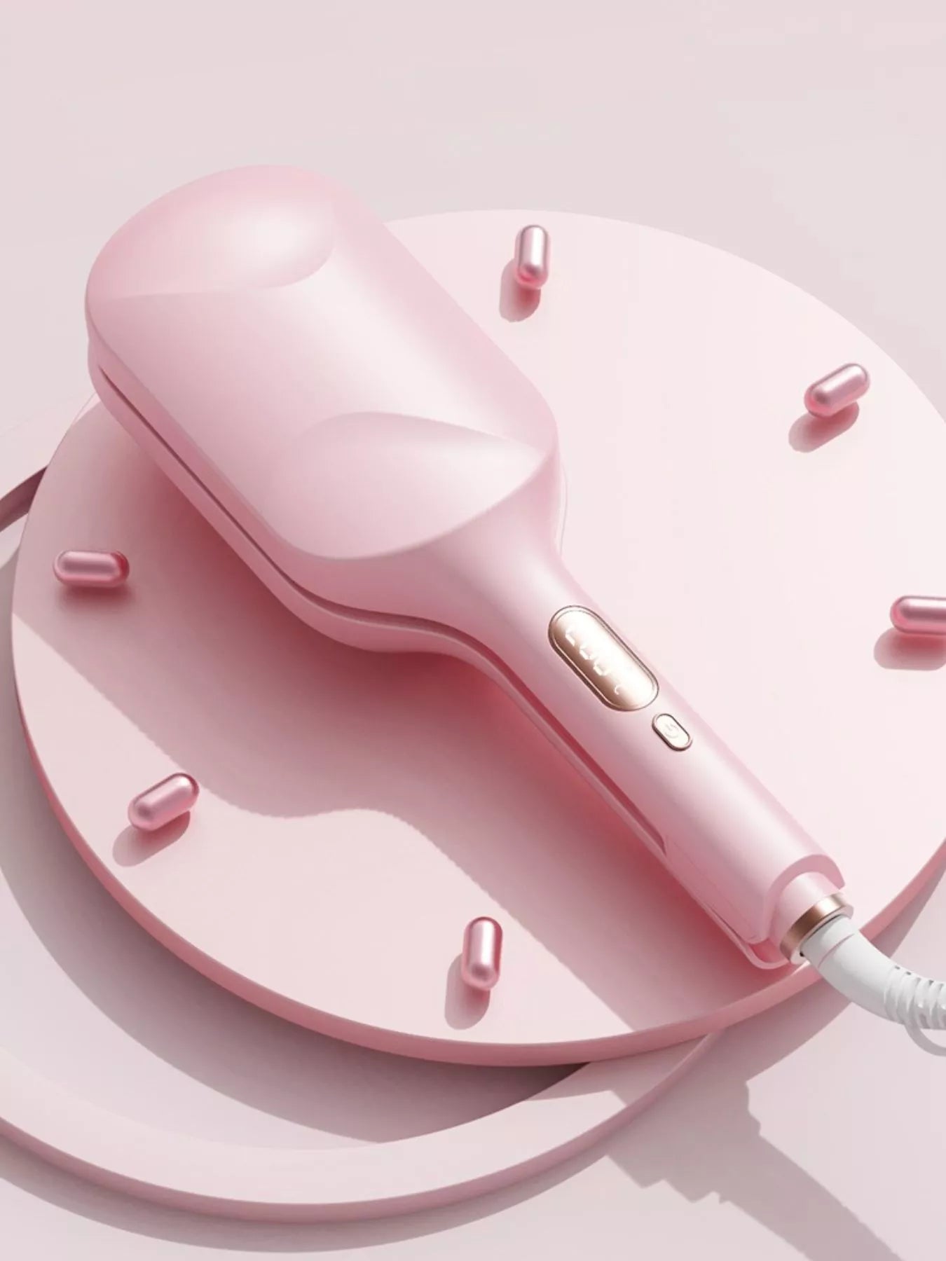 Blush pink Trendsi fast heating curling iron with European plug, showing a close-up of the curling barrel and handle.