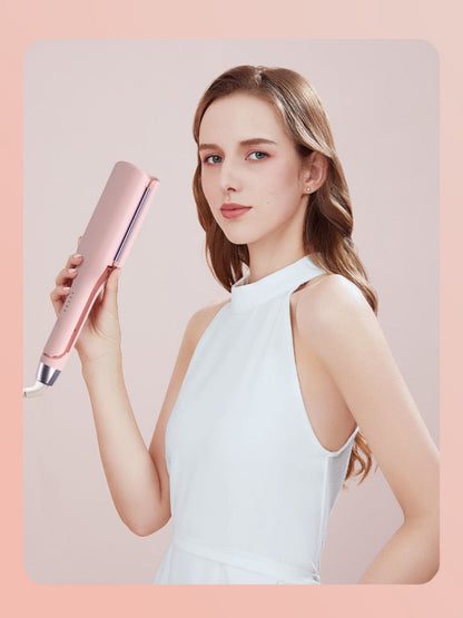 Blush pink Trendsi rotating ceramic hair curling iron with European plug, showcasing its ergonomic handle and ceramic barrel.