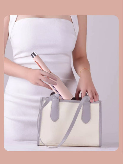 Blush pink European plug rotating ceramic hair curling iron by Trendsi, showcasing the curling barrel and ergonomic handle.