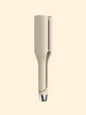Blush pink Trendsi rotating ceramic hair curling iron with European plug, showcasing its handle and curling barrel.