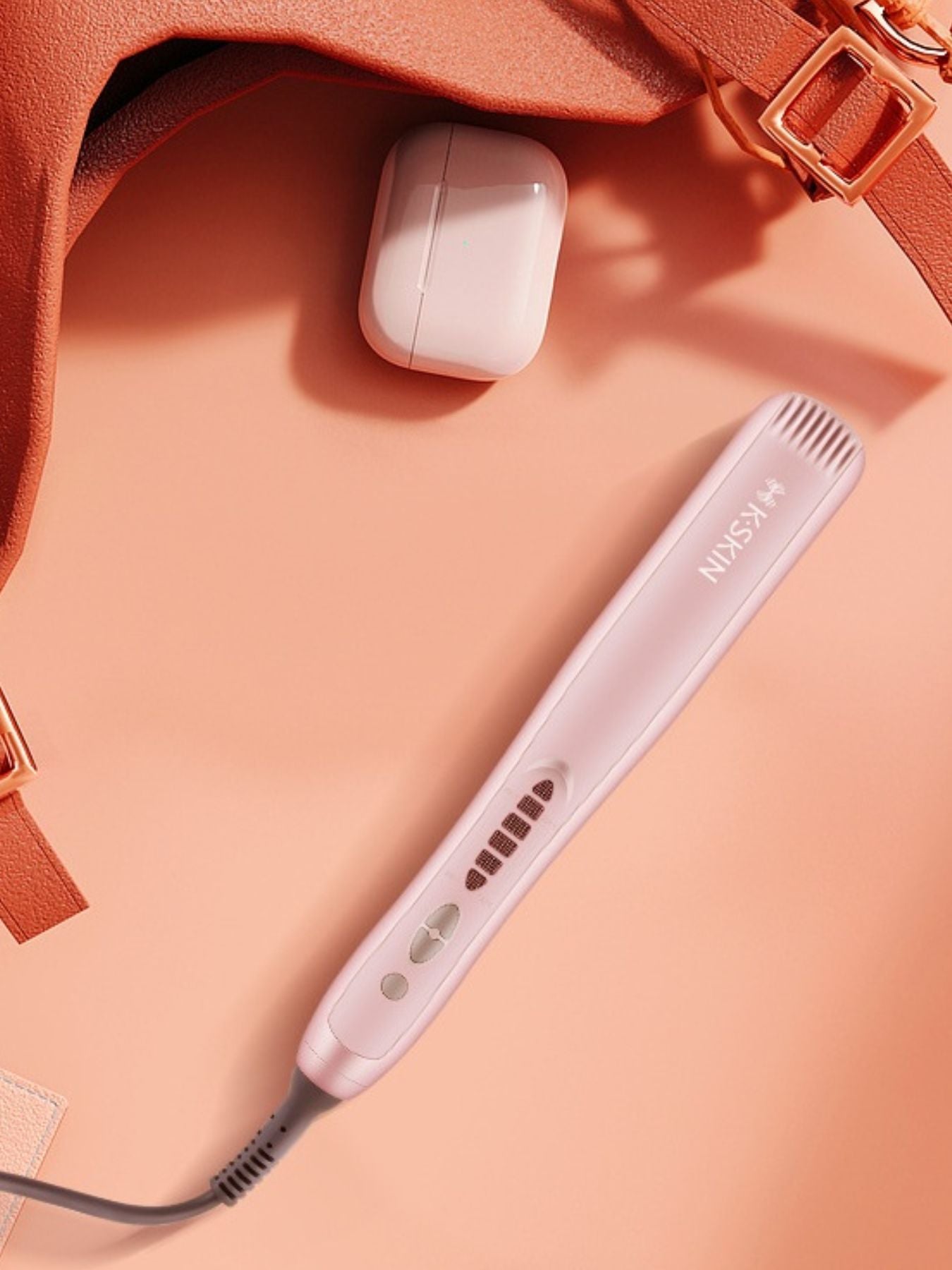 Blush pink Trendsi heated hair straightening comb with North American plug showing sleek design and ceramic heating plates.