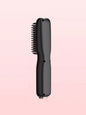 Blush pink portable heated hair straightening comb by Trendsi showing its compact design and heated teeth for quick styling.