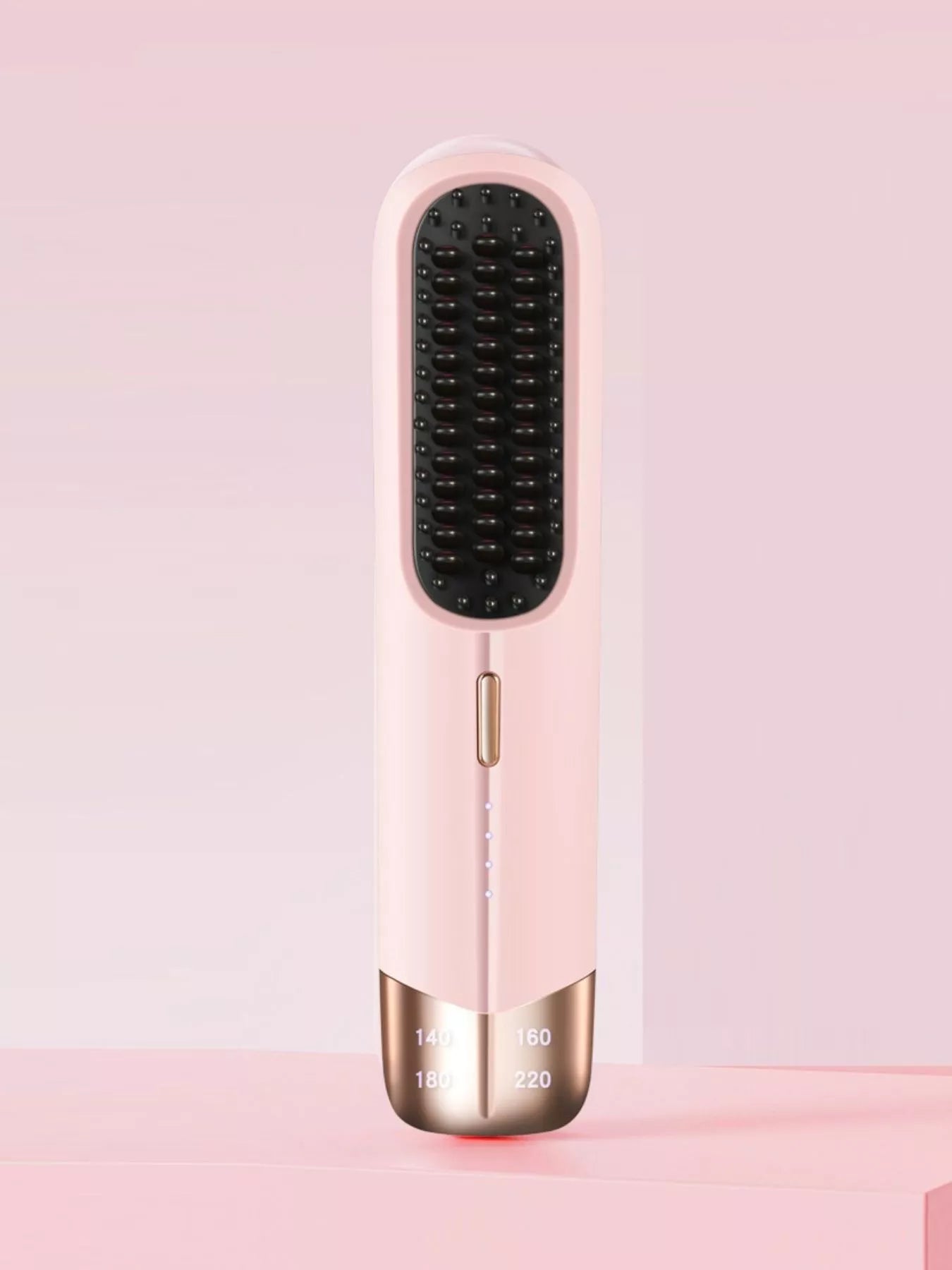 Blush pink portable wireless ionic straightener brush by Trendsi for smooth, straight hair styling on the go.