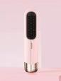 Blush pink portable wireless ionic straightener brush by Trendsi for smooth, straight hair styling on the go.
