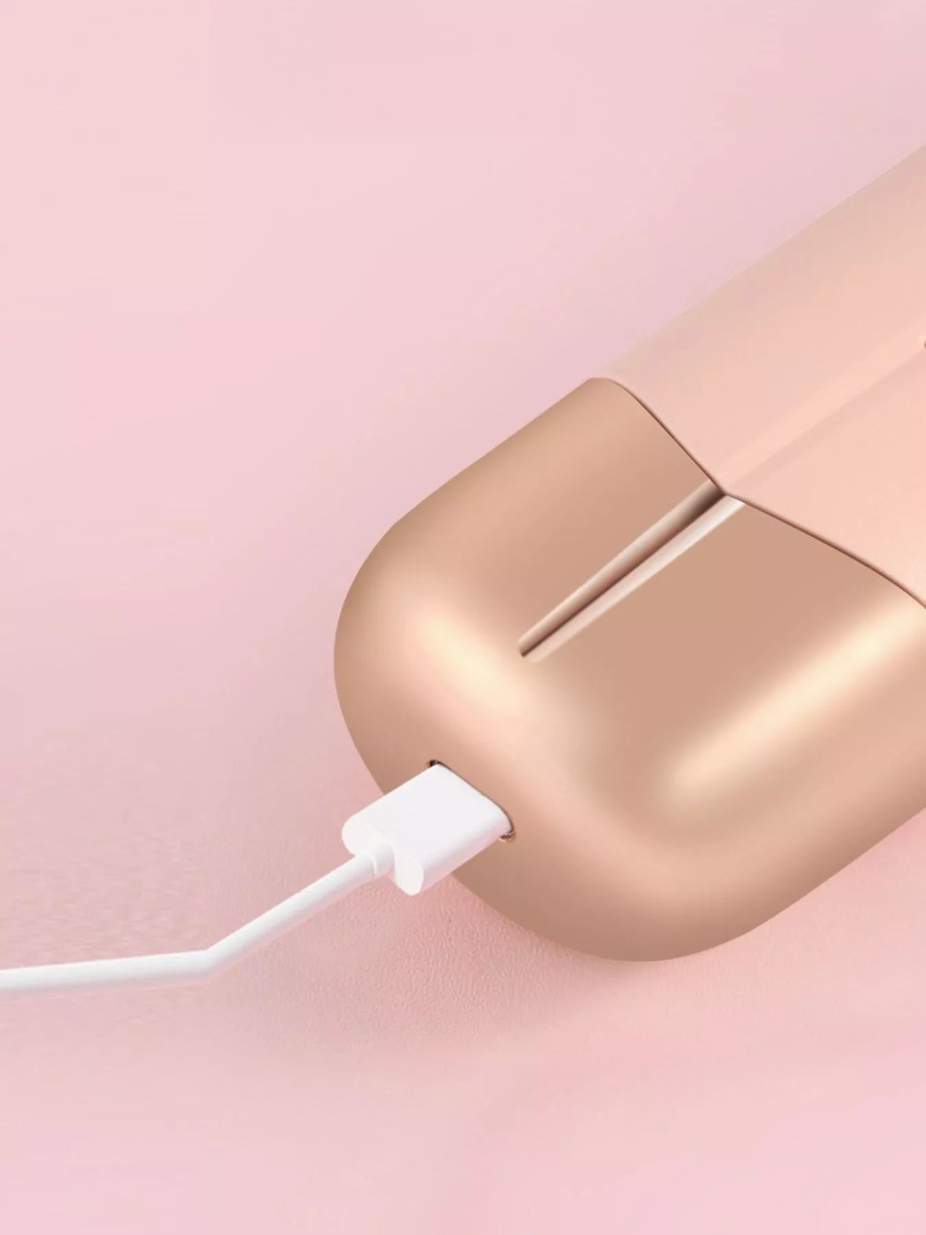 Blush pink portable wireless ionic straightener brush by Trendsi for smooth, straight hair styling on the go.