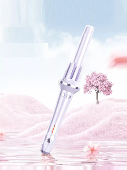 Blush pink automatic rotating hair curling iron by Trendsi with a sleek design and rotating barrel for effortless curls