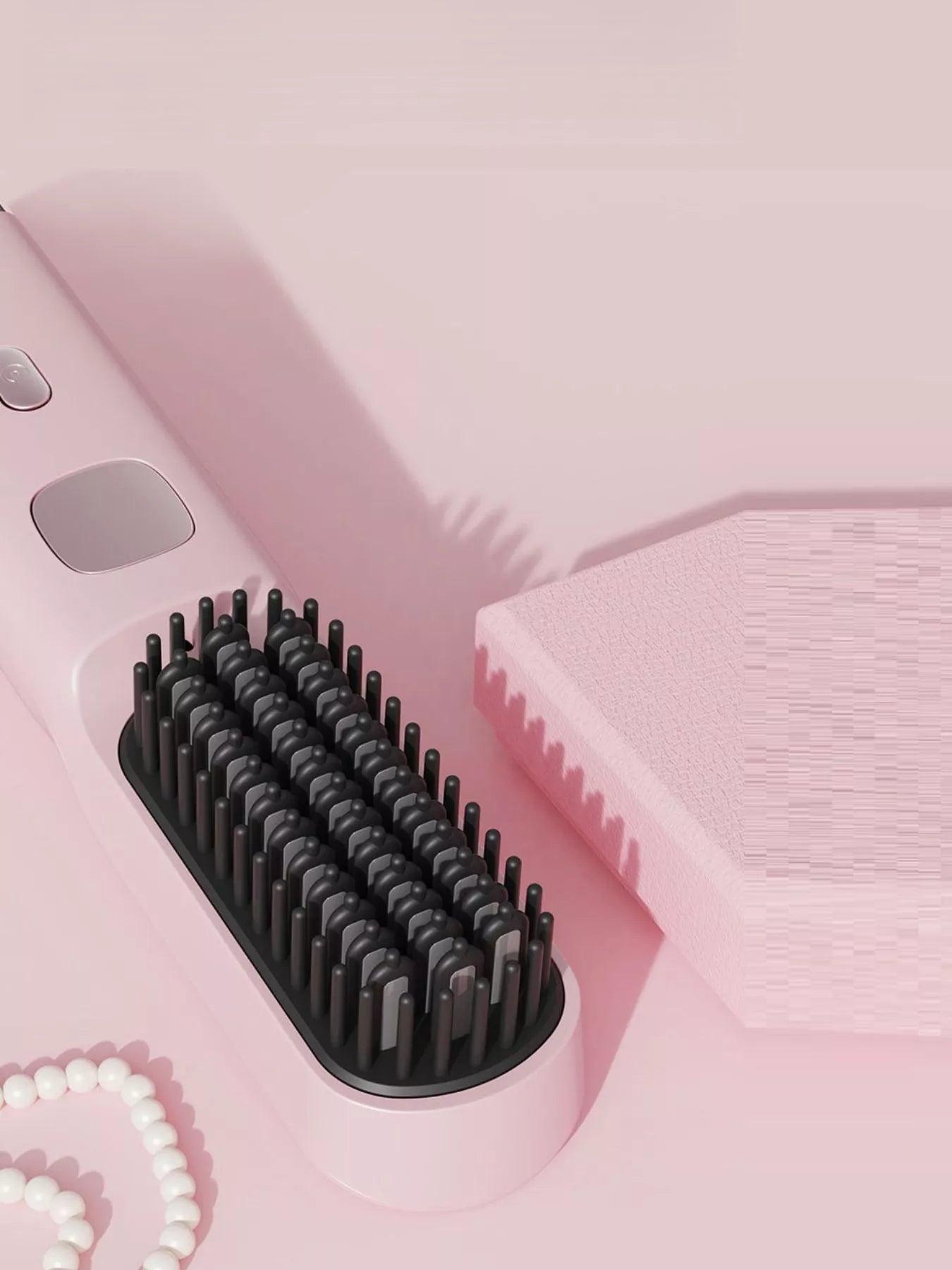 Blush pink Trendsi heated straightening comb with ergonomic handle for easy hair styling and smoothing.
