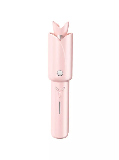 Blush pink portable curling iron by Trendsi with a sleek design and curling barrel, ideal for on-the-go styling.