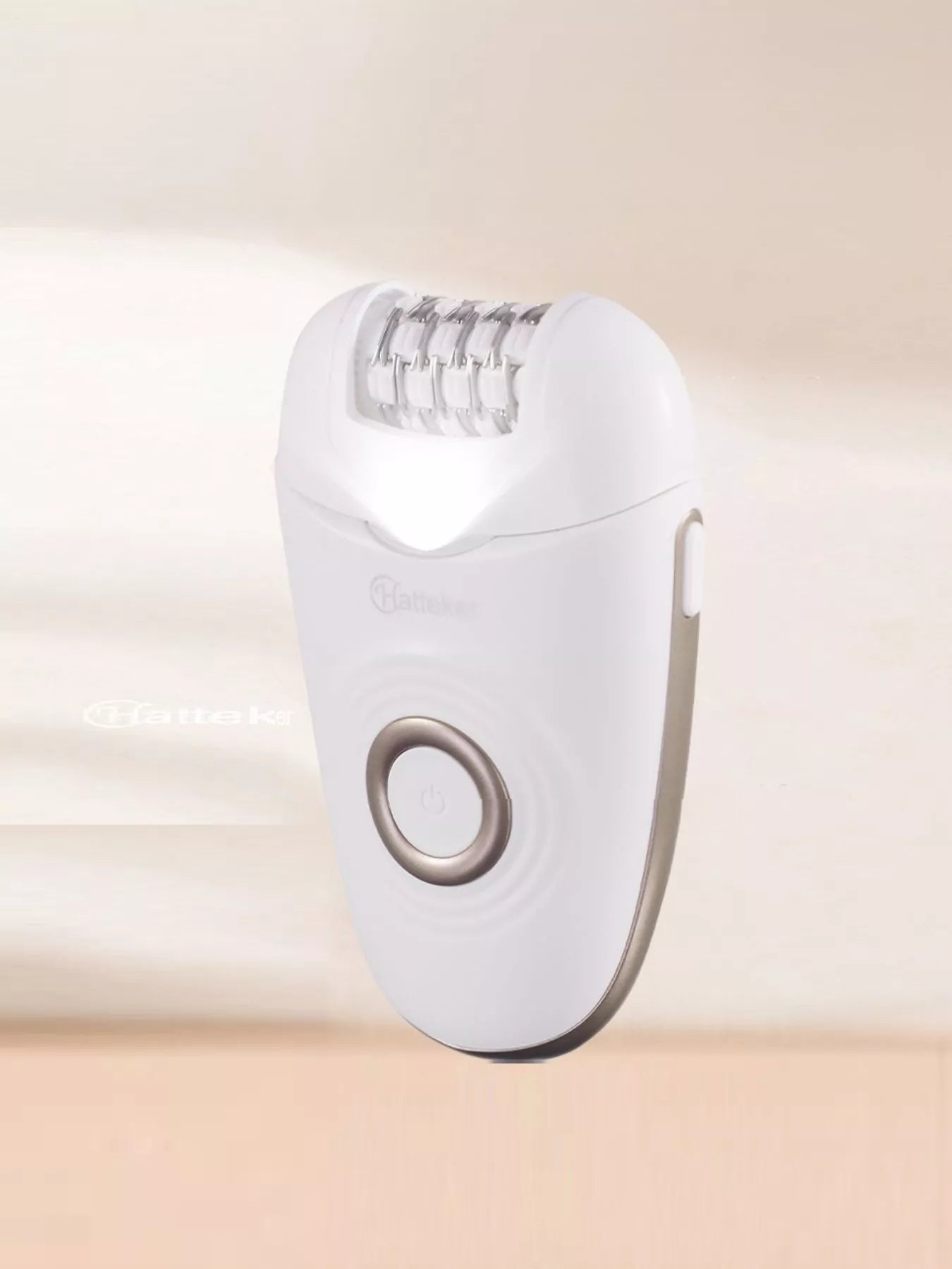 Blush pink portable hair removal epilator from Trendsi, compact and one-size, with multiple attachments for easy at-home use.