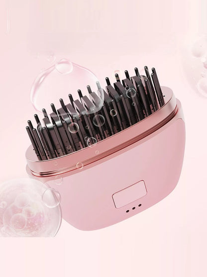 Blush pink portable heated hair straightening comb by Trendsi, compact design with adjustable heat settings for easy styling.