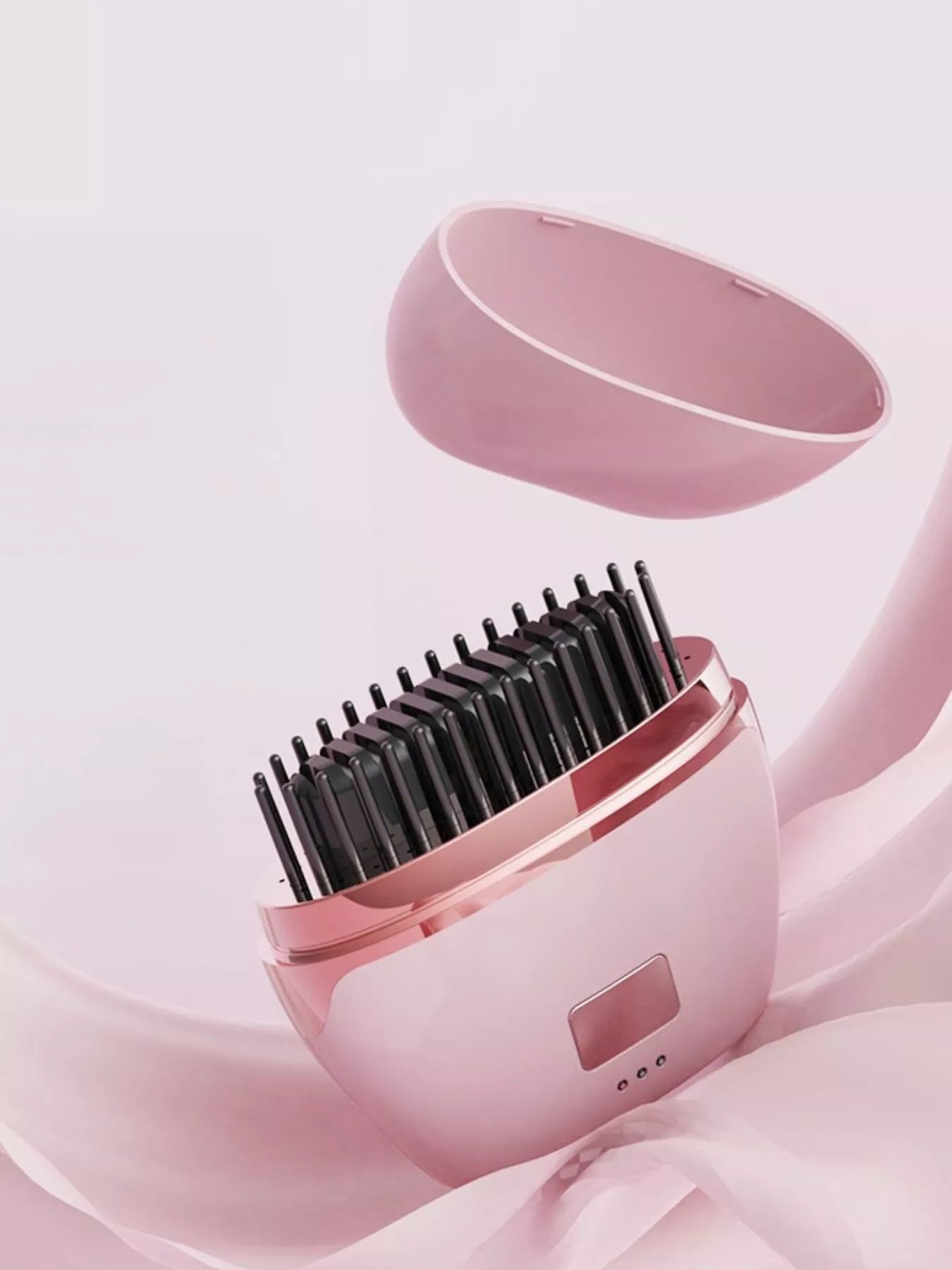 Blush pink portable heated hair straightening comb by Trendsi, compact styling tool with adjustable temperature settings.