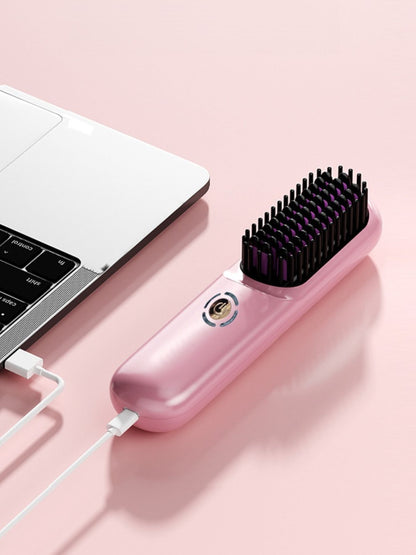 Blush pink portable heated hair straightening comb from Trendsi, compact and designed for easy styling on the go.