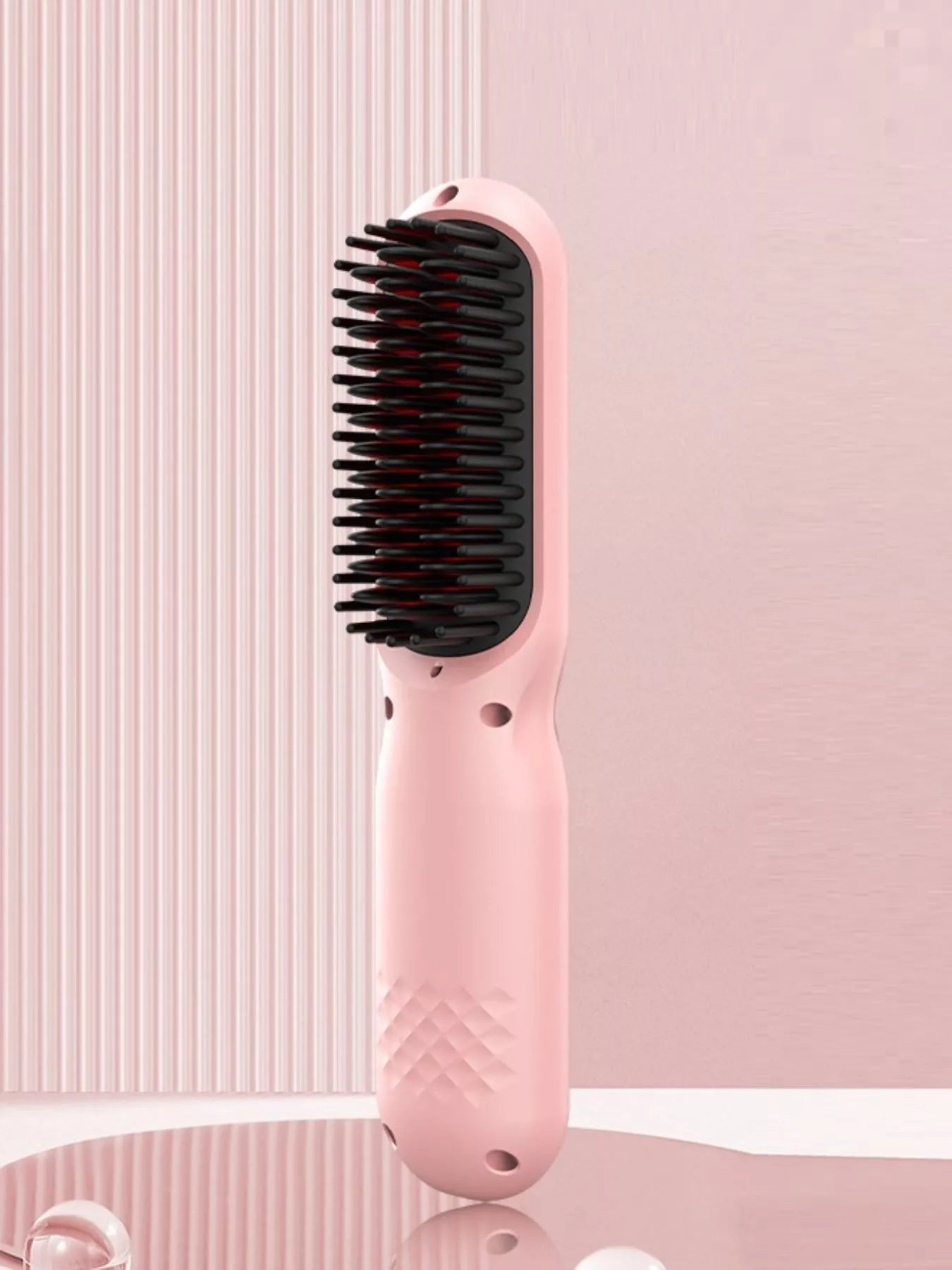 Blush pink portable heated straightening comb by Trendsi with a compact design and adjustable temperature controls.