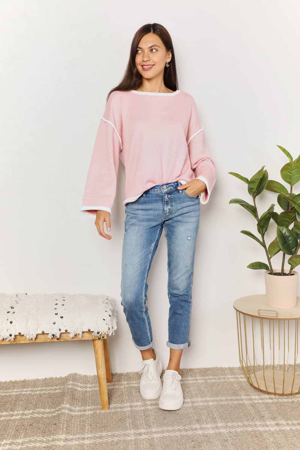 Blush pink knit top with angel wing contrast detail and dropped shoulder design from Trendsi.