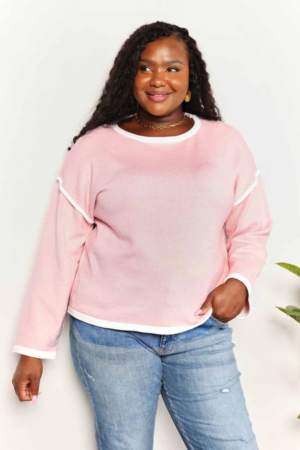 Blush pink knit top with angel wing contrast detail and dropped shoulder design, from Trendsi.