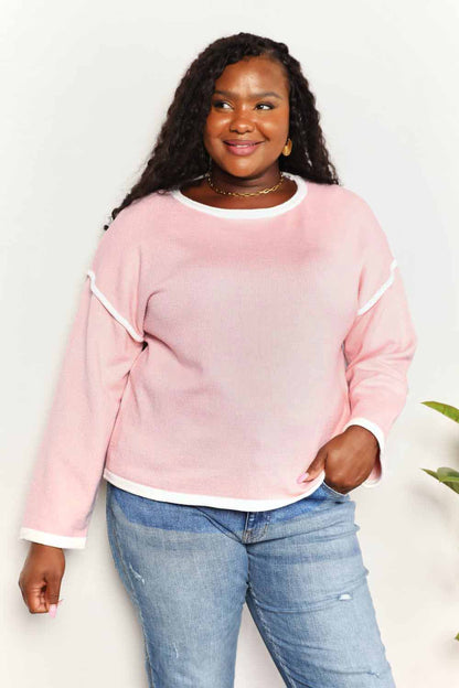 Blush pink knit top with angel wing contrast detail and dropped shoulder design, from Trendsi.