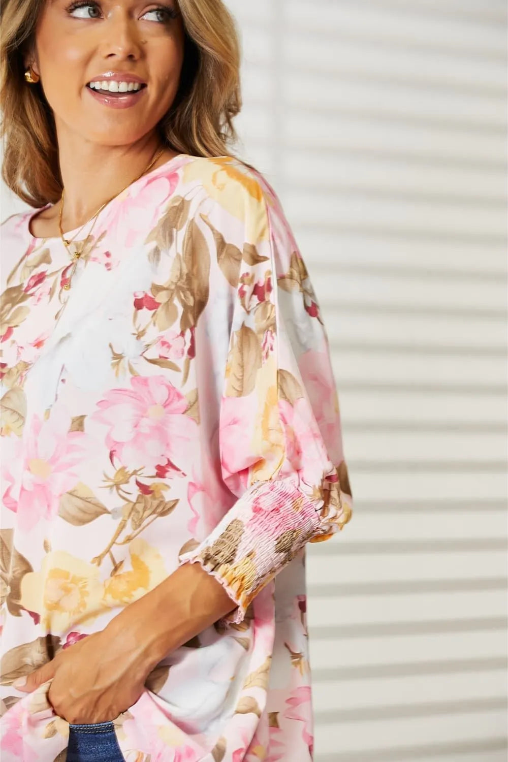Blush pink floral round neck top with three-quarter sleeves, by Trendsi, featuring a stylish and comfortable design.