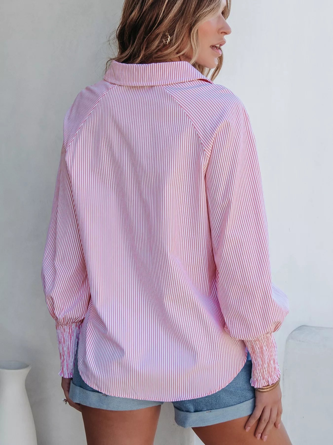 Blush pink pinstripe long sleeve blouse with smocked cuffs and button-up shirt collar, stylish Trendsi women's shirt.