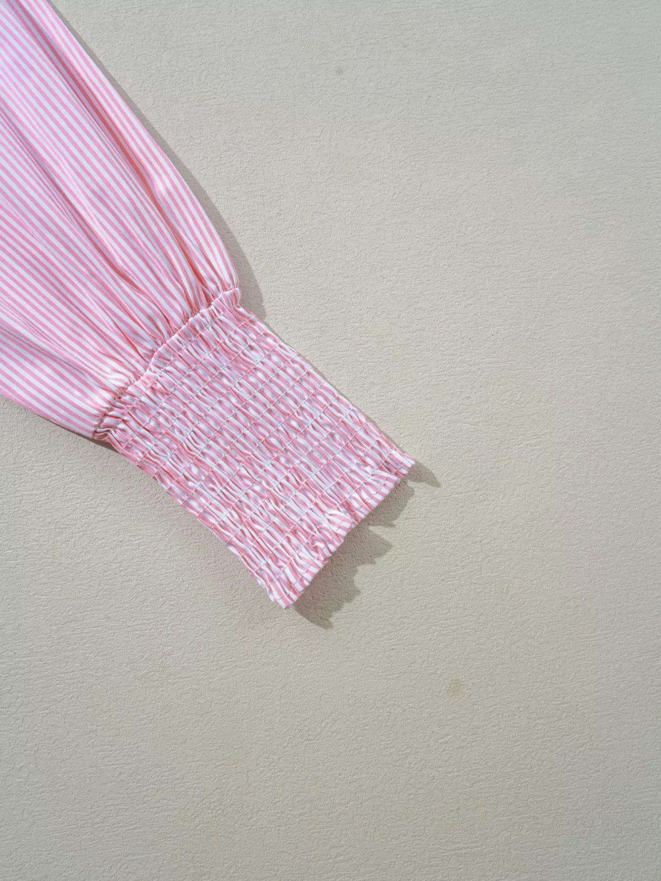 Blush pink pinstripe long sleeve blouse with smocked cuffs and button-down shirt collar, stylish Trendsi women's shirt.