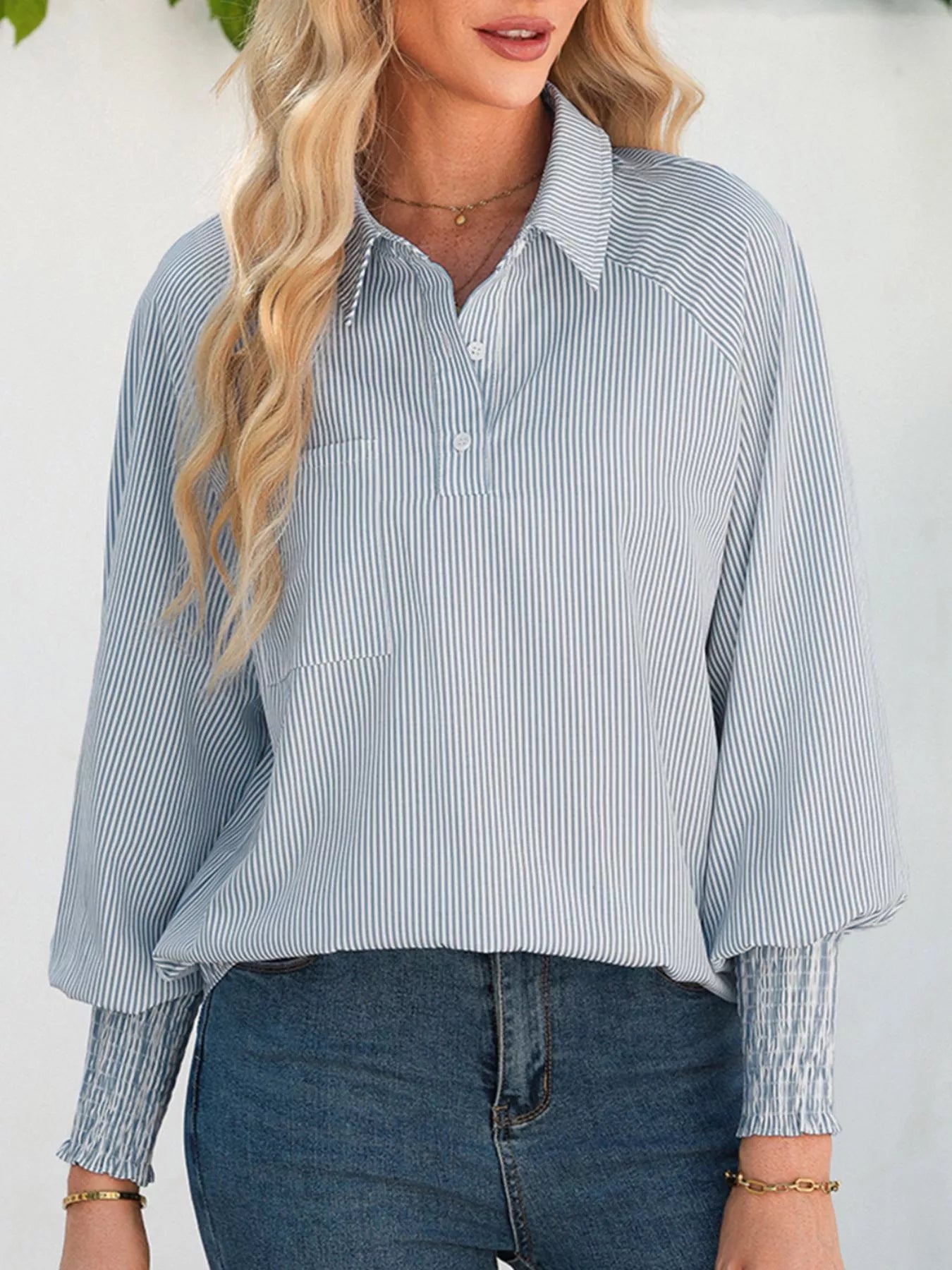 Blush pink pinstripe long sleeve blouse with smocked cuffs, button front, and shirt collar by Trendsi.
