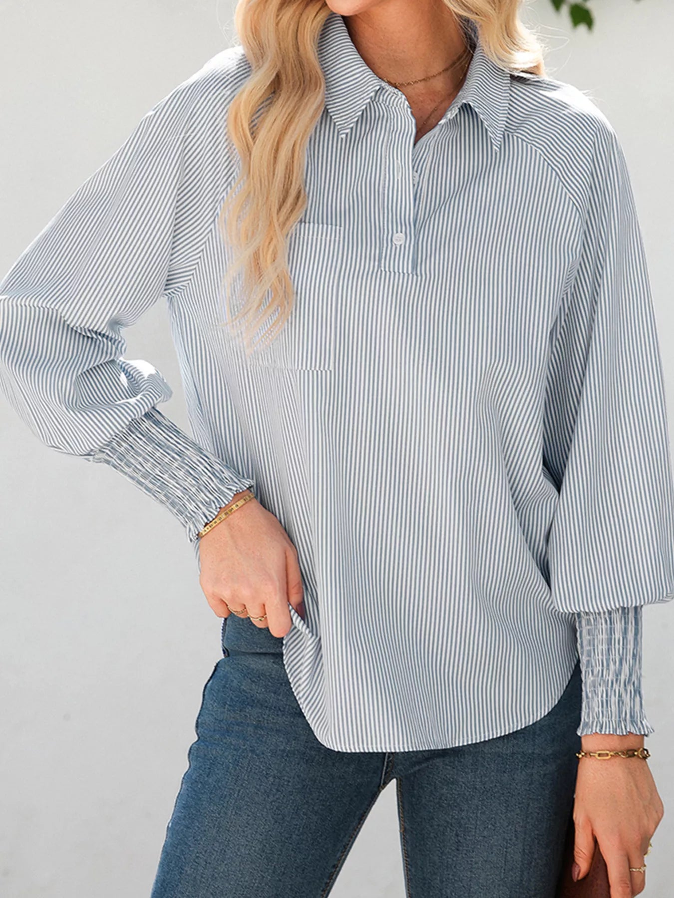 Blush pink pinstripe long sleeve blouse with smocked cuffs, button-down front, and classic shirt collar by Trendsi.