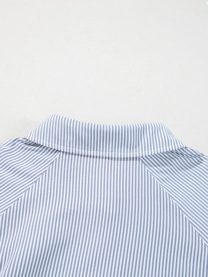 Blush pink pinstripe long sleeve blouse with smocked cuffs, button front, and shirt collar from Trendsi.