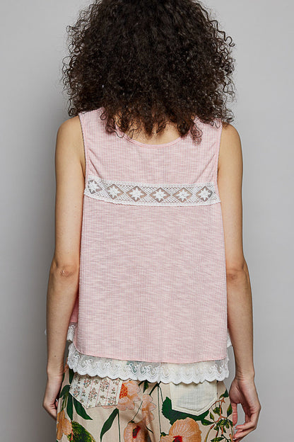 Blush pink sleeveless top with lace trim, ruffle hem, button details, and round neck from Trendsi.