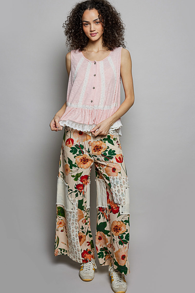 Blush pink sleeveless top with lace trim, ruffle hem, button details, and round neck from Trendsi.