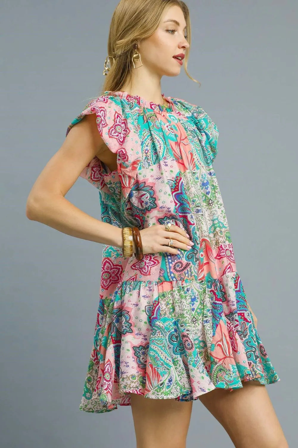 Blush pink Umgee printed ruffle cap sleeve mini dress with floral pattern, lightweight fabric, and relaxed fit.