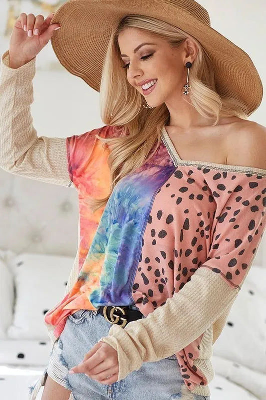 Blush BiBi print block V-neck top by Trendsi featuring contrast stitching and relaxed fit, perfect for casual or dressy occasions.