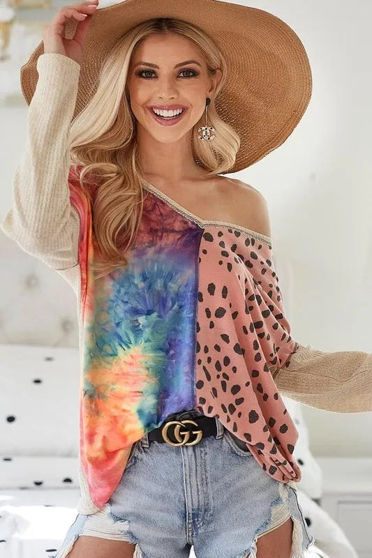 Blush BiBi print block V-neck top with contrast stitching from Trendsi, featuring a stylish V-neckline and detailed stitching.