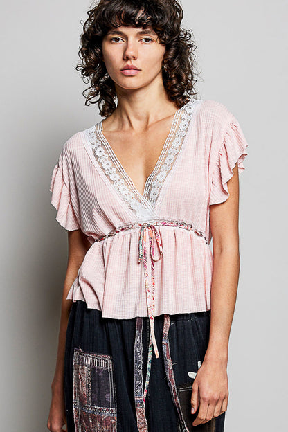 Blush POL Tied Ruffled V-Neck Short Sleeve Blouse with lace detail, trendy and feminine fashion by Trendsi.