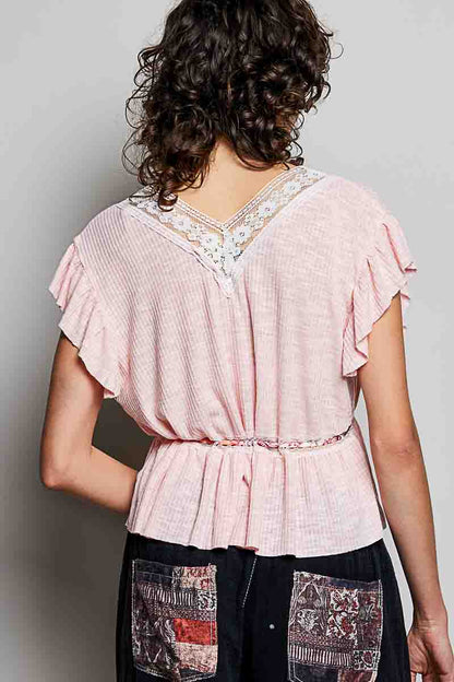 Blush pink POL Tied ruffled V-neck short sleeve blouse with lace detail by Trendsi, featuring feminine ruffles and delicate lace accents.