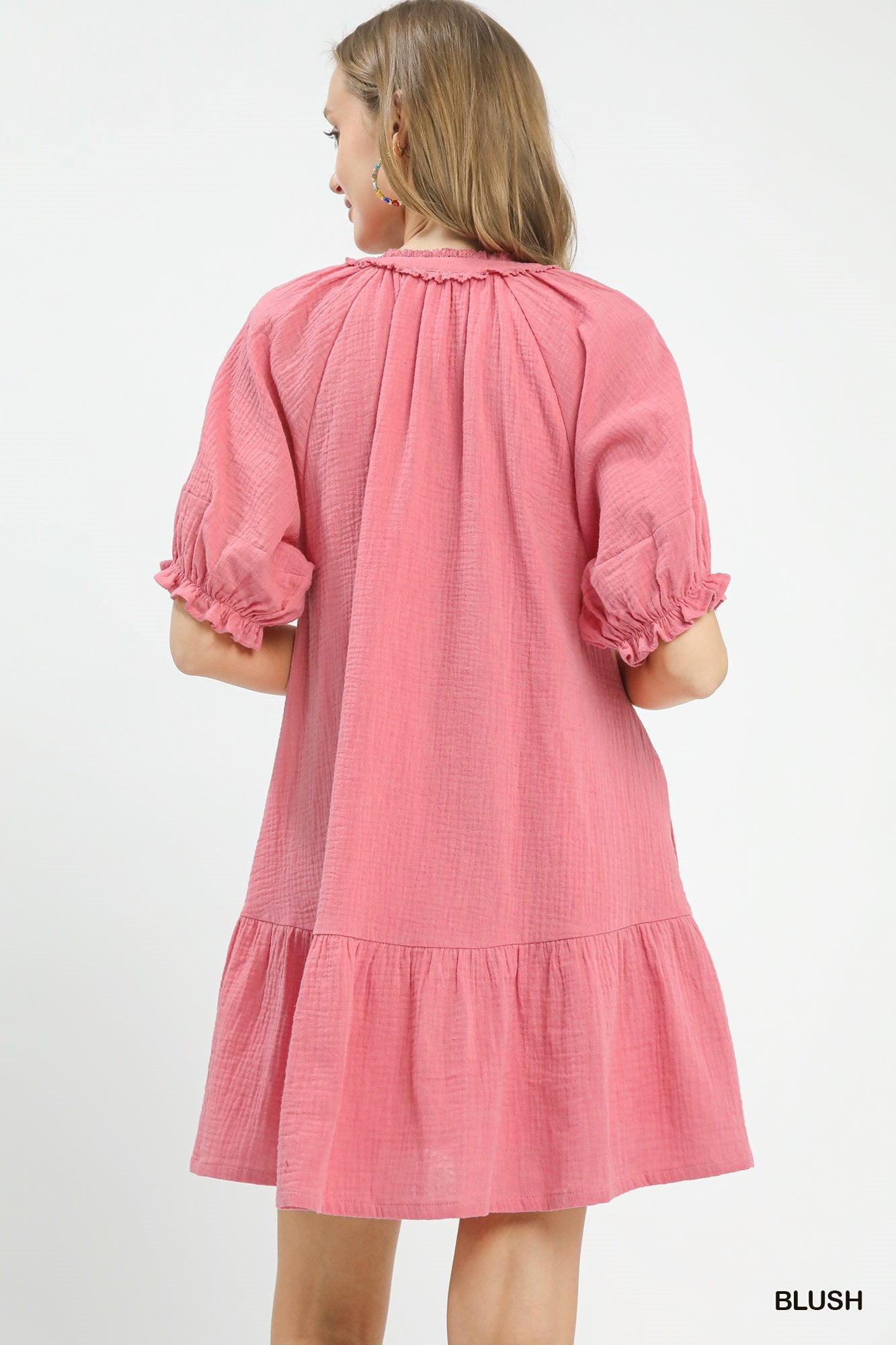 Blush pink Umgee cotton gauze mini dress by Trendsi, lightweight and relaxed fit, displayed on a hanger.