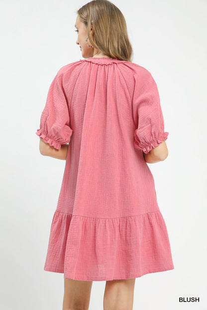 Blush pink Umgee cotton gauze mini dress by Trendsi, lightweight and relaxed fit, displayed on a hanger.