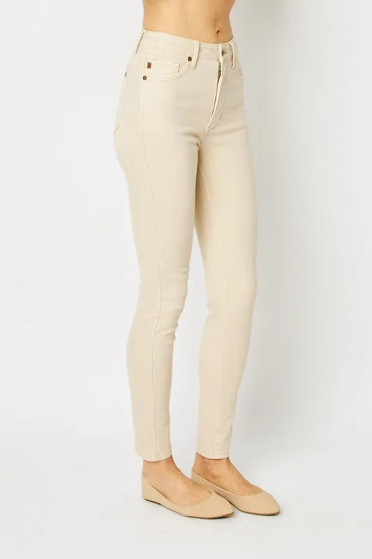 Trendy Judy Blue full-size garment dyed tummy control skinny jeans with sleek fit and deep color, displayed on a model.