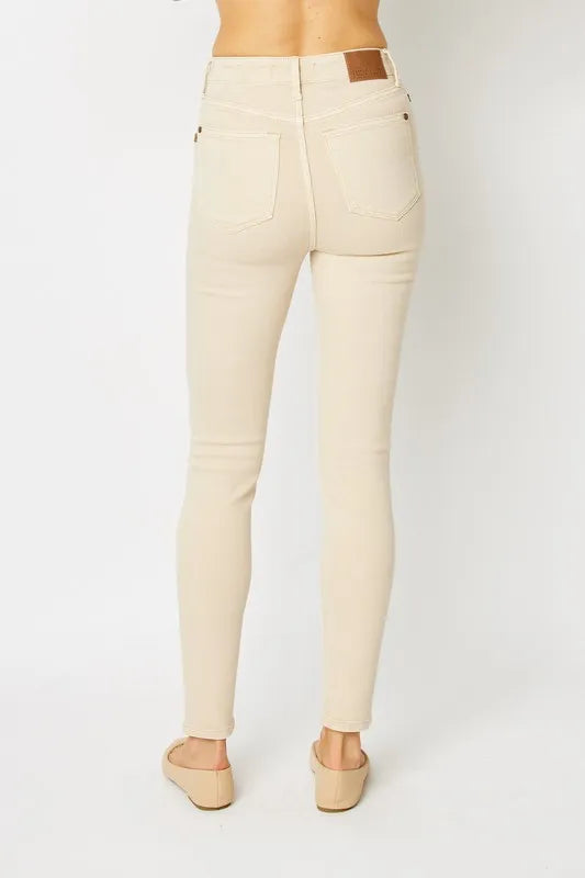 Judy Blue full size garment dyed tummy control skinny jeans with a fitted silhouette and classic five-pocket design.