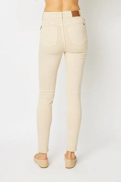 Judy Blue full size garment dyed tummy control skinny jeans with a fitted silhouette and classic five-pocket design.