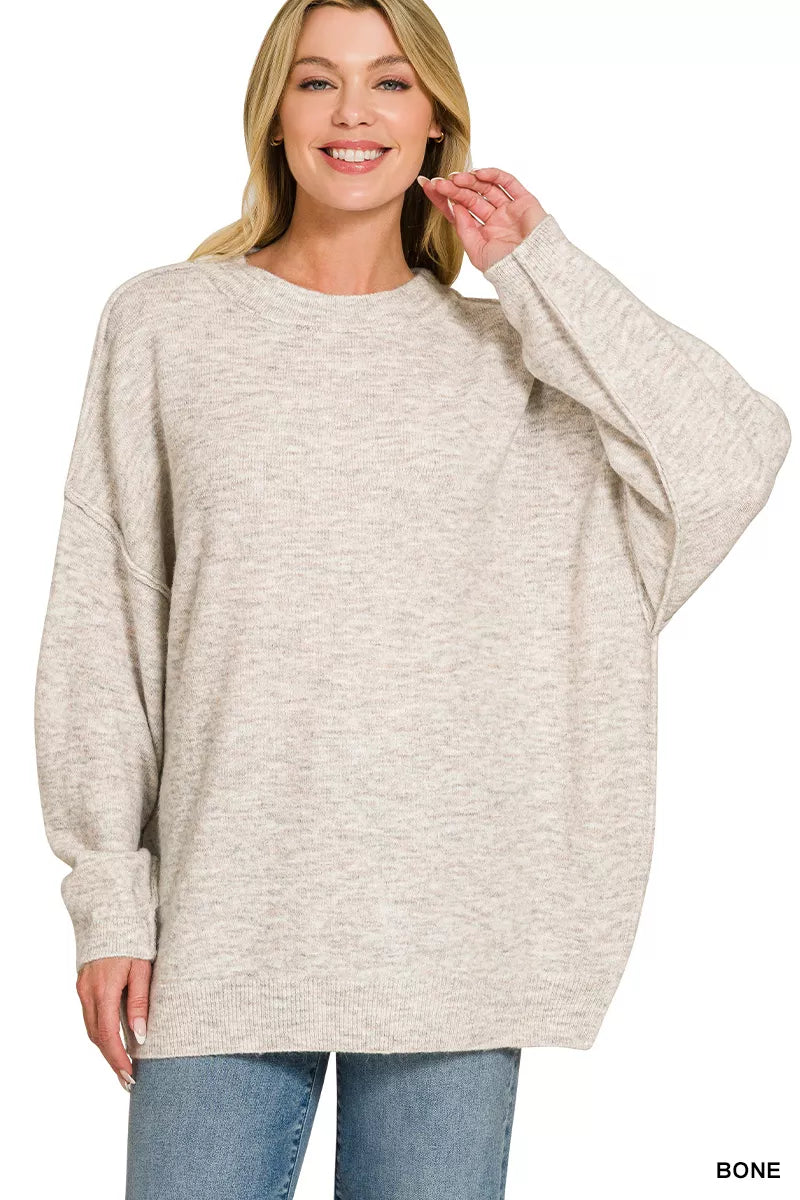 Zenana oversized round neck melange sweater with exposed seams, in a cozy, textured knit, perfect for casual stylish wear.